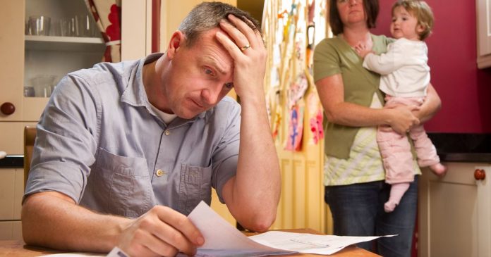 Man-Paying-the-Bills-looking-worried